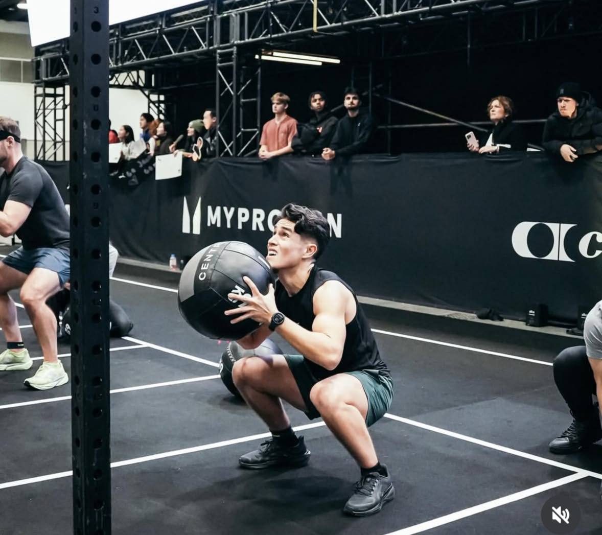 Wall ball reps during a HYROX race station