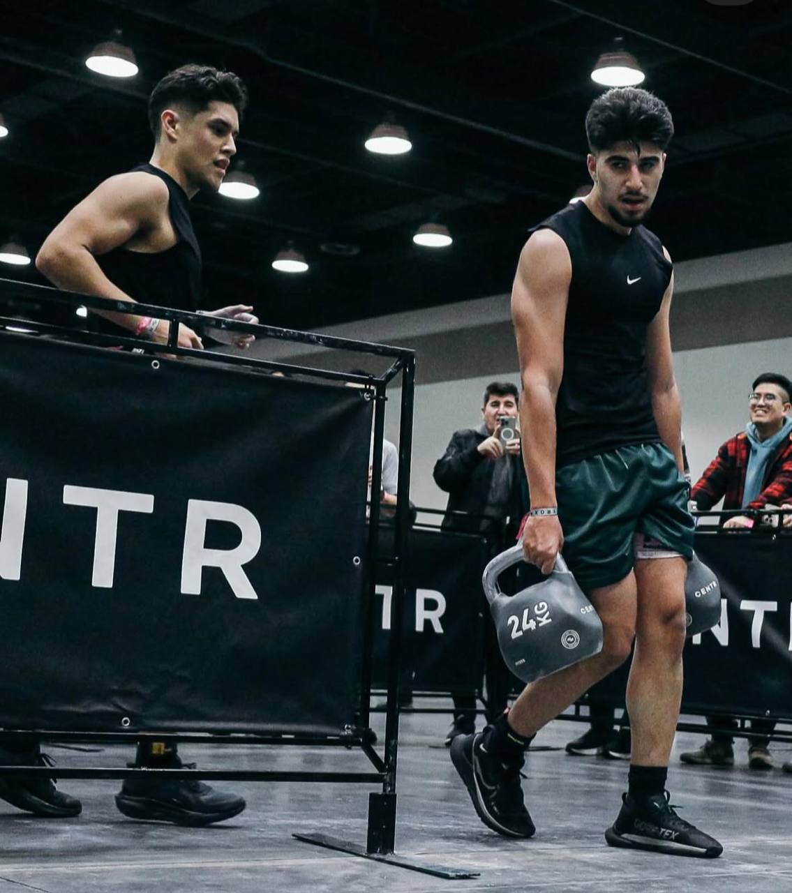 Fit4Life athletes mid farmers carry at HYROX Vancouver